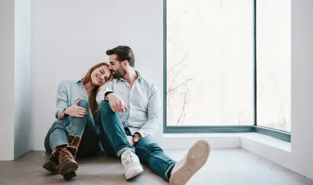 Happy couple in new apartment